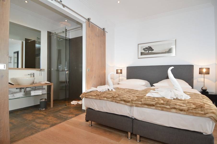 Das Schlafzimmer mit Bad en Suite